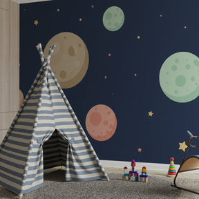 Colorful space wallpaper with planets and stars decorating kids playroom wall