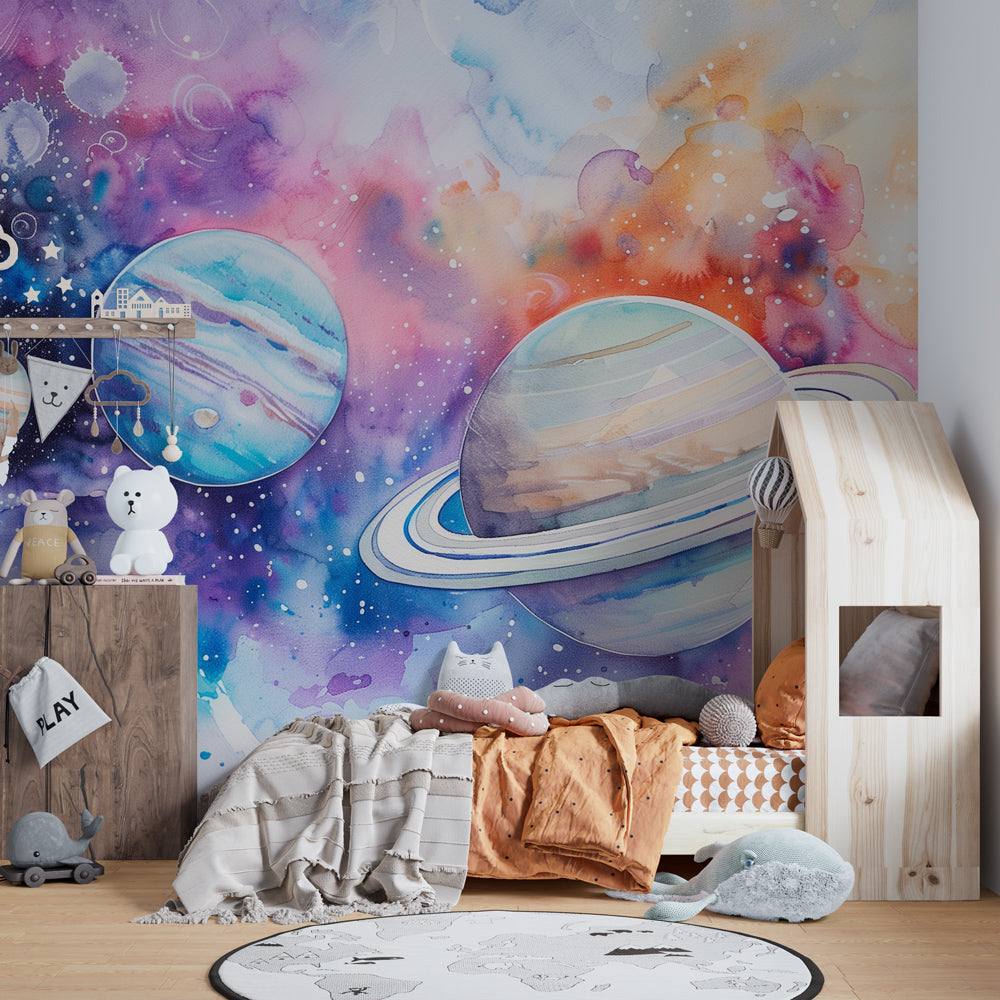 Kids bedroom featuring blue watercolor universe wallpaper with planets and nebulae design