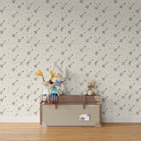 Space adventure themed children's room with rocket and star mural wallpaper installation