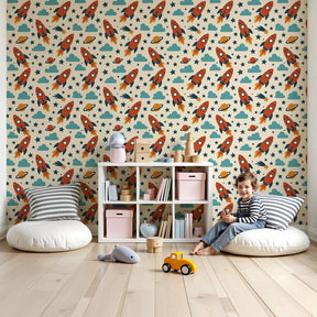 Space rocket mural wallpaper in modern children's bedroom with colorful rockets and clouds by Kids-Mundo