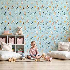 Space rocket mural wallpaper in modern kids bedroom with blue rockets and stars by Kids-Mundo