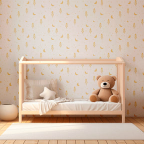 Golden rocket and moon wallpaper creating dreamy children's bedroom decor