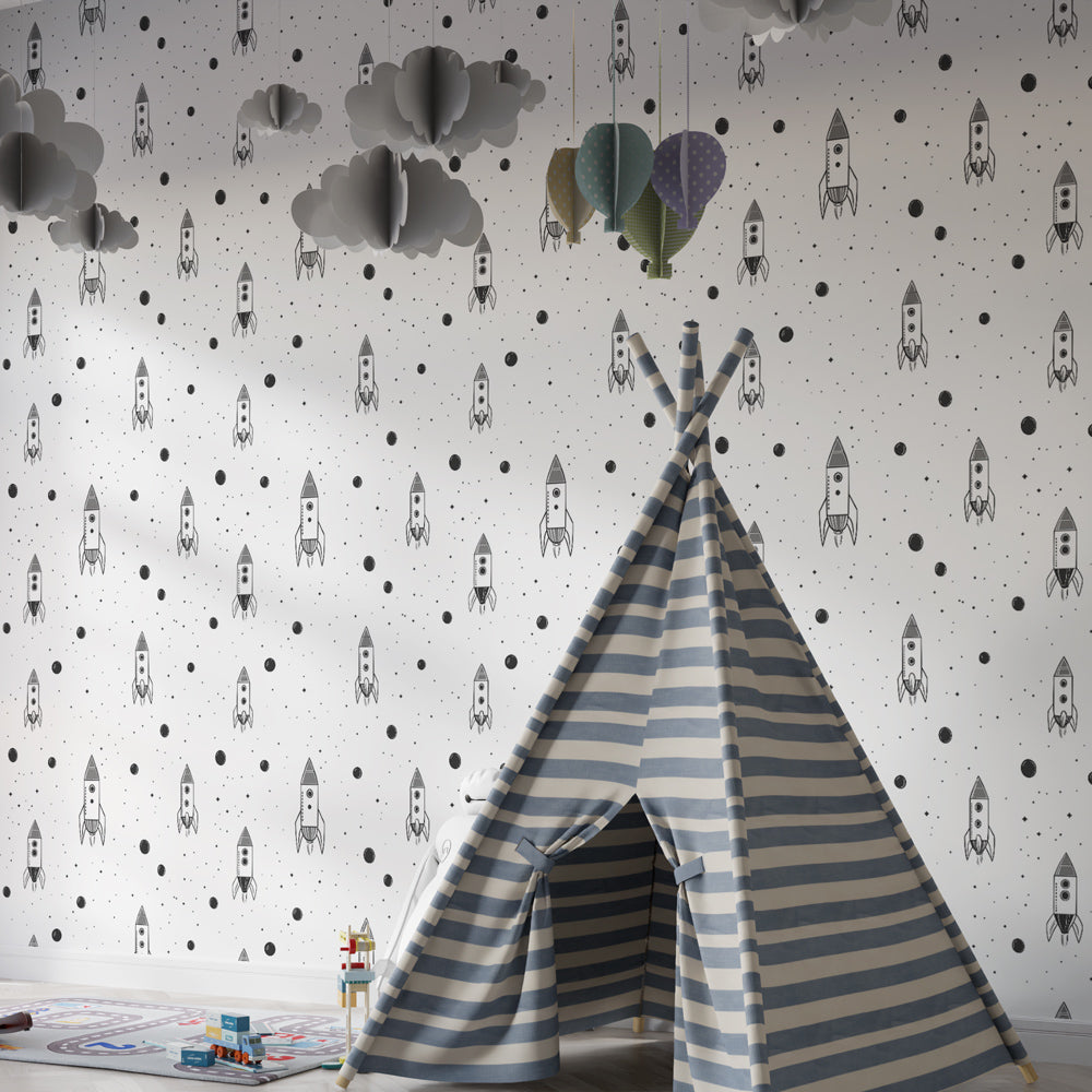 Monochrome space rocket wallpaper creating cosmic adventure theme in children's bedroom