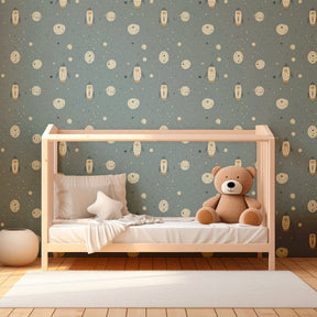 Blue space wallpaper featuring rockets and planets in cozy nursery room decor