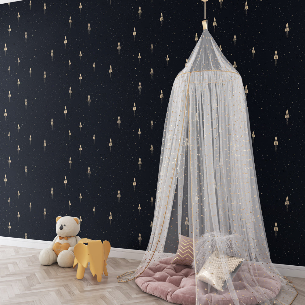 Astronaut themed wallpaper creating cosmic adventure nursery decor with golden space rockets