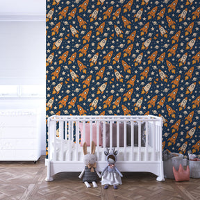 Colorful rocket wallpaper creating galactic nursery decor with stars and planets