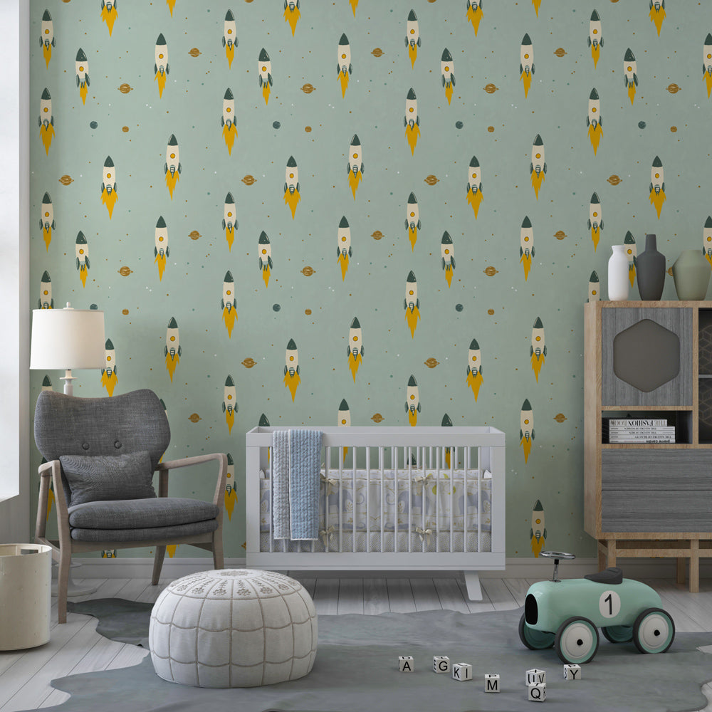 Colorful rocket wallpaper creating cosmic themed nursery decor with green background