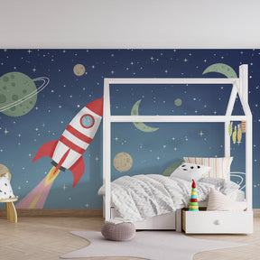 Space adventure mural wallpaper featuring rocket and cosmic elements in bright children's playroom setting