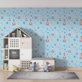 Colorful rocket and planet wallpaper transforming playroom into space adventure zone