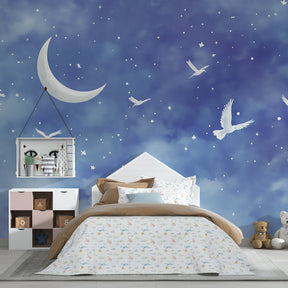 Blue starry night mural wallpaper transforming baby room into magical celestial sanctuary