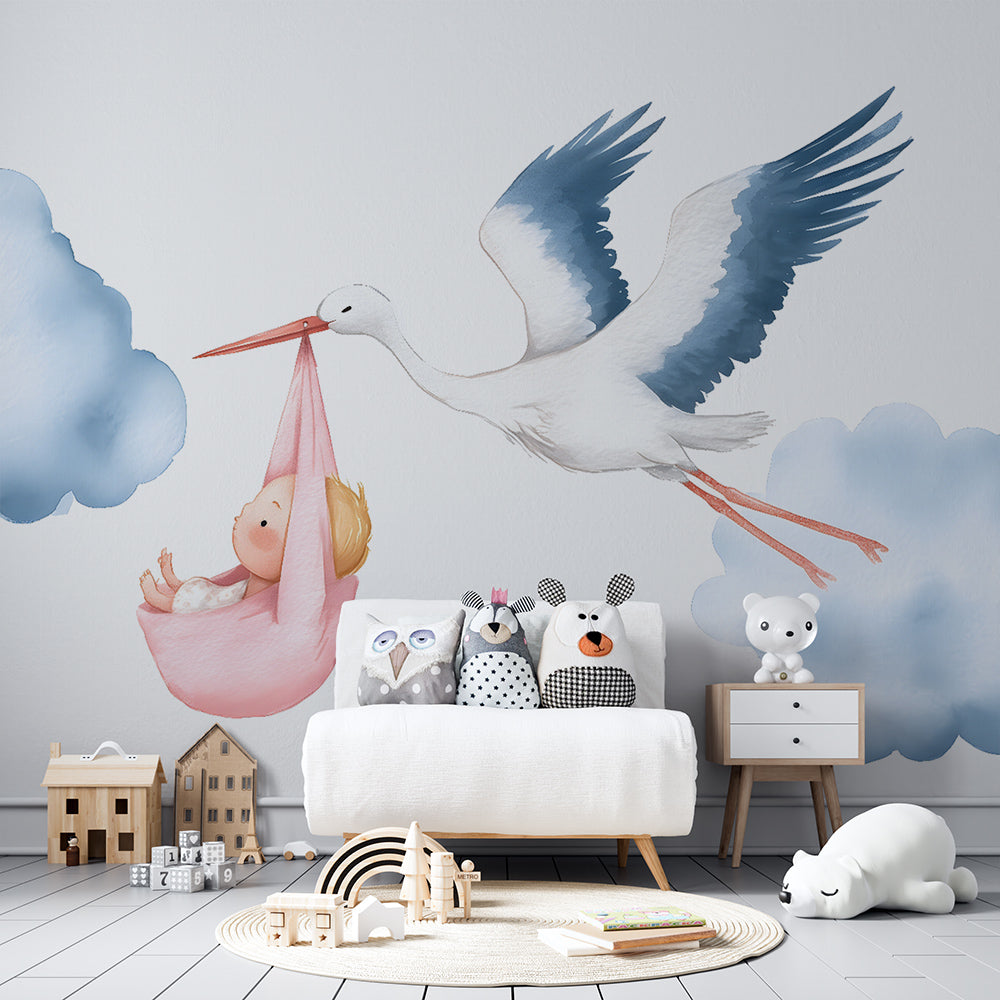 Kids-Mundo stork carrying a baby wall mural in a playroom, made-to-measure wallpaper in soft pastel tones.