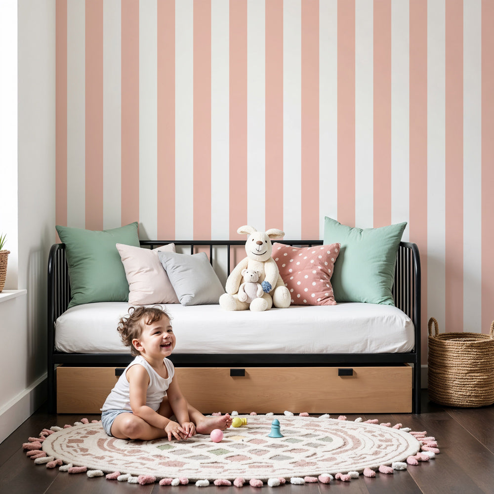 Soft pink stripe mural wallpaper in elegant baby nursery with white furniture by Kids-Mundo