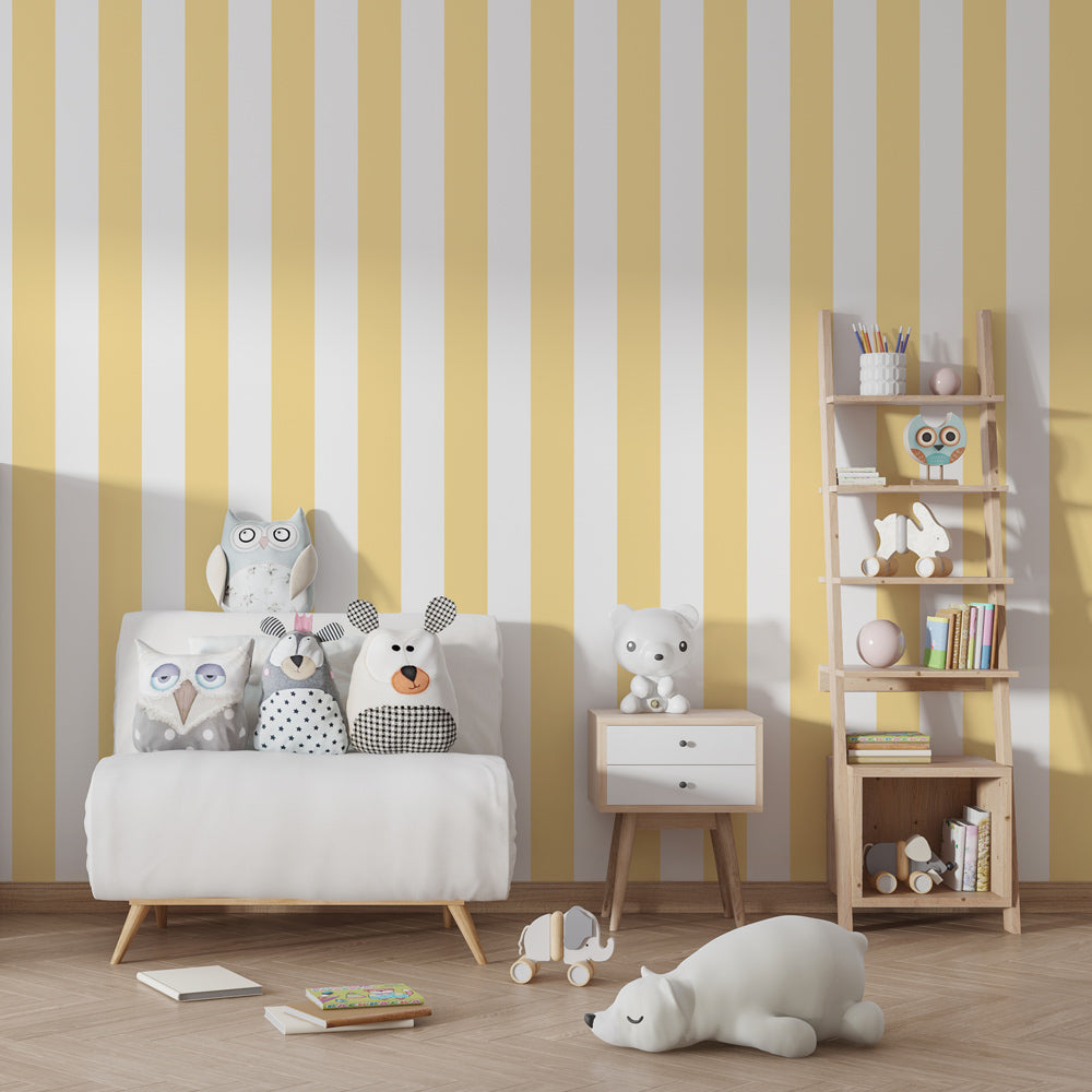 Yellow striped wallpaper creating calming nursery atmosphere with light wood furniture