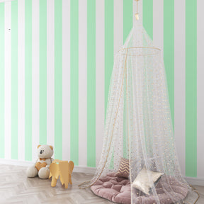 Pastel green striped mural wallpaper enhancing bright kids playroom by Kids-Mundo