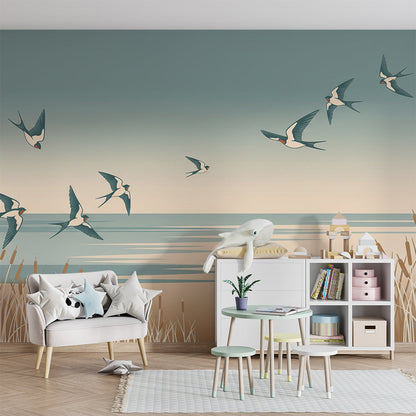 Kids-Mundo flock of swallows mural covering a playroom wall, made-to-measure shoreline wallpaper.