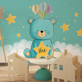 Star and cloud teddy bear wallpaper complementing light wood nursery furniture