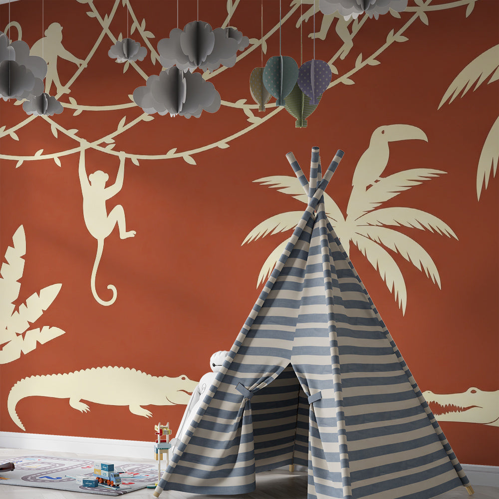 Kids-Mundo bold terracotta jungle wallpaper mural featuring toucans and palms in a kids bedroom
