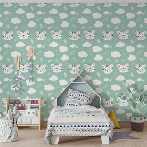 Smiling tiger faces wallpaper with clouds and leaves in colorful kids playroom