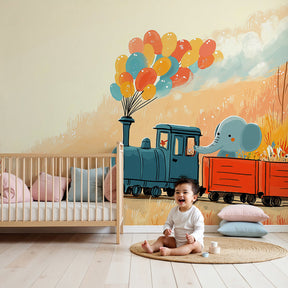 Train adventure mural wallpaper with elephant and balloons in cozy nursery by Kids-Mundo