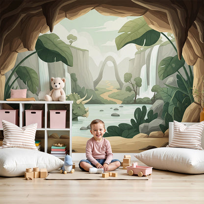 Kids-Mundo triceratops cave wall mural in an earthy green nursery with a wooden cot.
