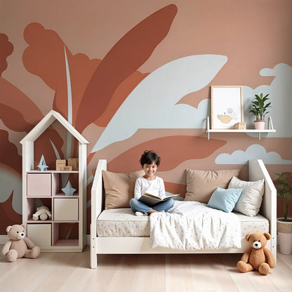 Kids-Mundo tropical leaf and cloud wall mural styled behind a cot in a warm nursery