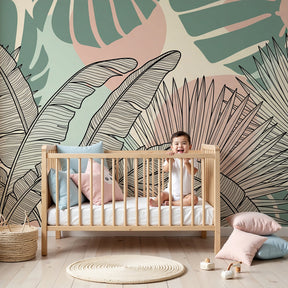 Tropical leaves mural wallpaper in modern nursery with wooden crib by Kids-Mundo