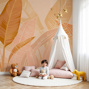 Tropical leaves mural wallpaper with soft pink orange tones in modern nursery by Kids-Mundo