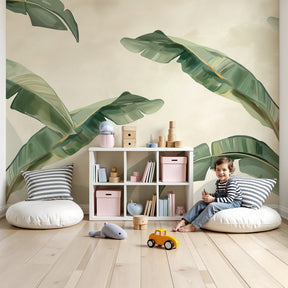 Tropical leaves mural wallpaper creating serene nursery atmosphere with natural green botanicals by Kids-Mundo