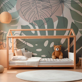 Nature-themed tropical mural wallpaper with green and pink leaves in kids playroom setting