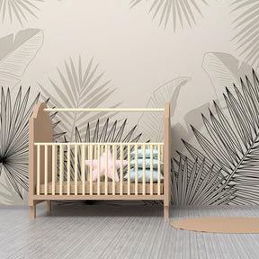Minimalist tropical leaves mural wallpaper creating calm reading corner in kids playroom