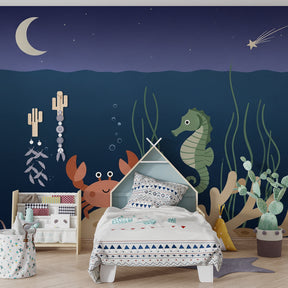 Sea life wallpaper creating calming underwater atmosphere in baby bedroom decor