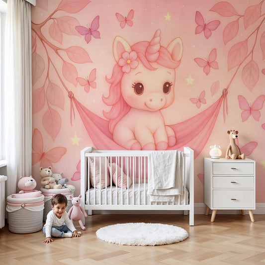 Kids-Mundo pink unicorn and butterfly wall mural styled in a soft pastel nursery with a cot and rug.