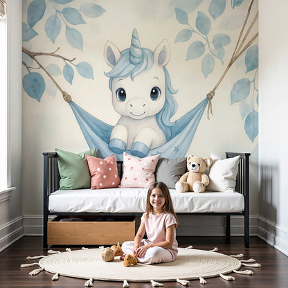 Kids-Mundo baby unicorn hammock wall mural styled above a cot in a soft blue nursery.
