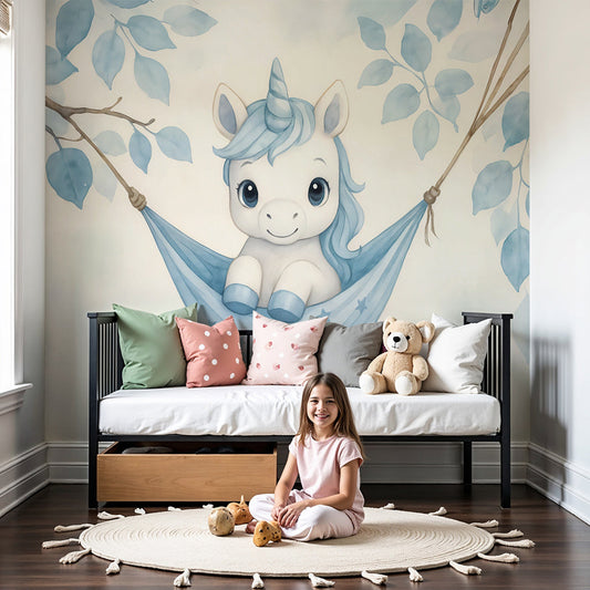 Kids-Mundo baby unicorn hammock wall mural styled above a cot in a soft blue nursery.