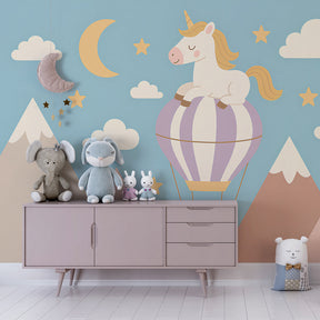 Children's bedroom featuring magical unicorn wallpaper with mountains and clouds design
