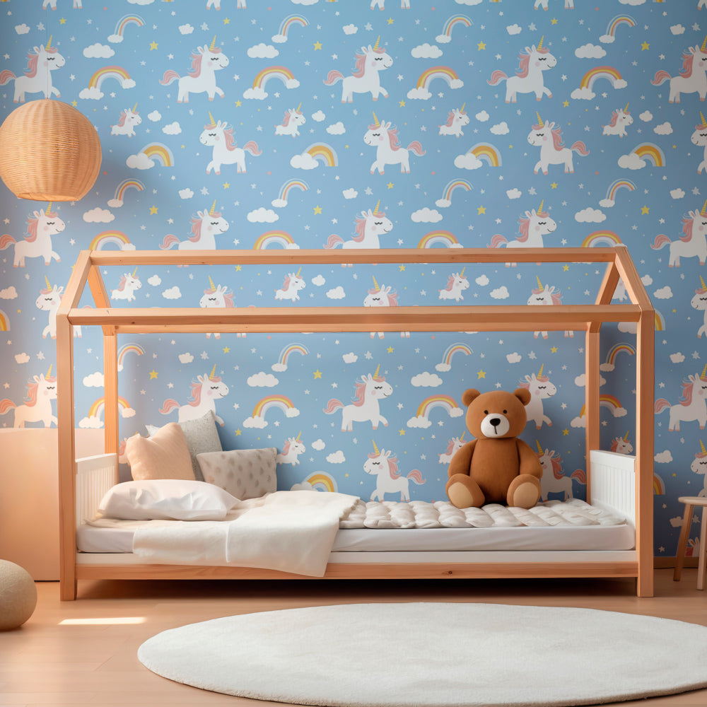 Blue unicorn mural wallpaper with rainbows decorating peaceful nursery space
