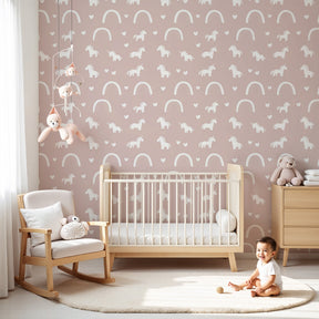 Pink unicorn mural wallpaper with rainbows decorating modern nursery room by Kids-Mundo