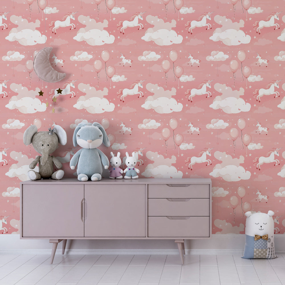 Whimsical unicorn wall mural with balloons and clouds decorating children's playroom space