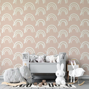 Whimsical unicorn and rainbow wallpaper transforming kids playroom into fairy tale space