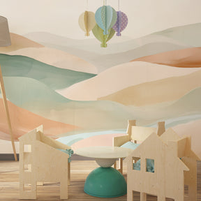 Soft watercolor landscape wallpaper in modern baby bedroom with gentle rolling hills design