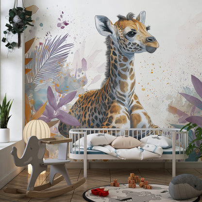Kids-Mundo watercolour baby giraffe mural with painterly leaves shown in a playroom