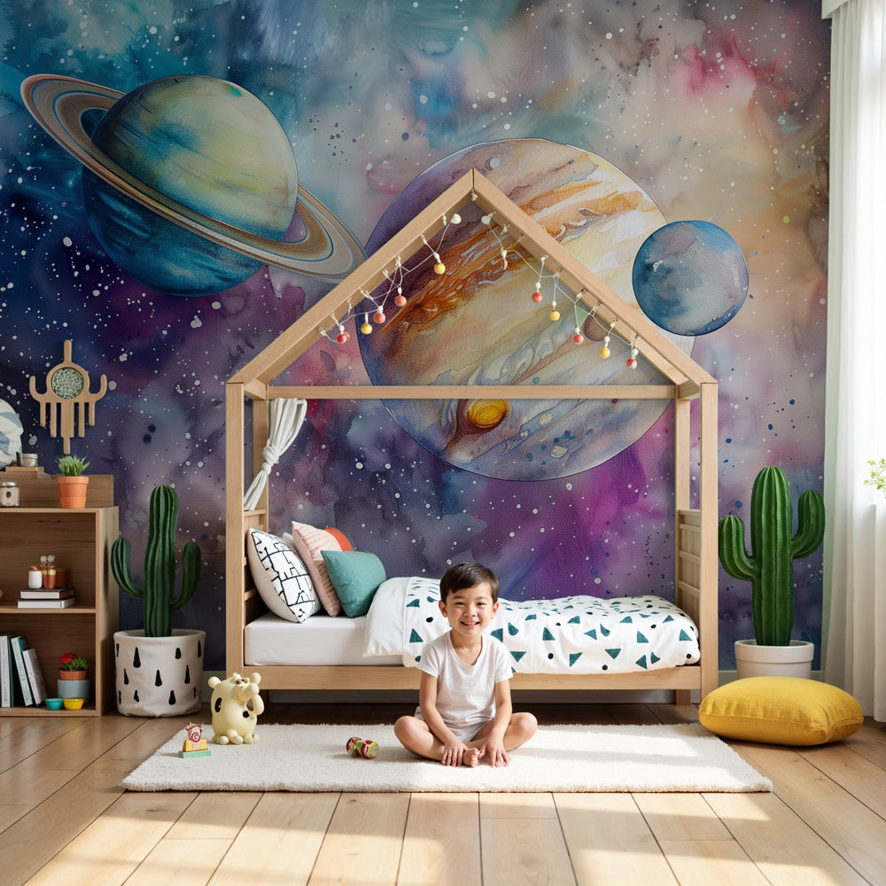 Kids-Mundo watercolour space wall mural with Saturn and Jupiter styled above a cot in a nursery