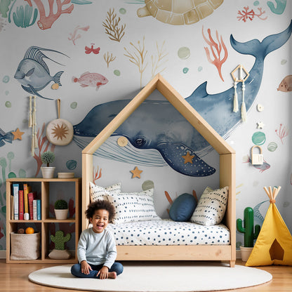 Kids-Mundo watercolour whale ocean wall mural styled in a soft white nursery