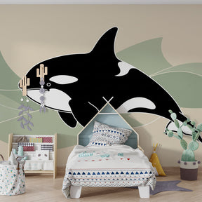 Marine animal mural wallpaper featuring friendly orca in modern baby room with botanical elements