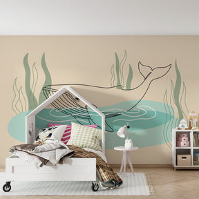 Ocean themed mural wallpaper with whale design transforming kids playroom into marine sanctuary
