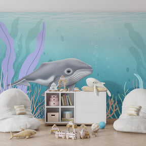 Underwater whale wallpaper creating magical marine atmosphere in children's playroom