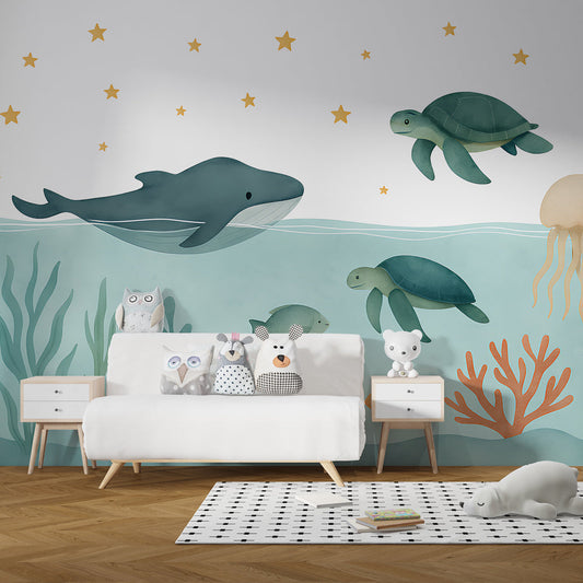 Kids-Mundo whale and sea turtle wall mural behind a bed in a child's ocean-themed bedroom