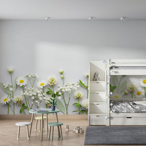 Soft white flower wallpaper with green foliage in cozy children's bedroom setting