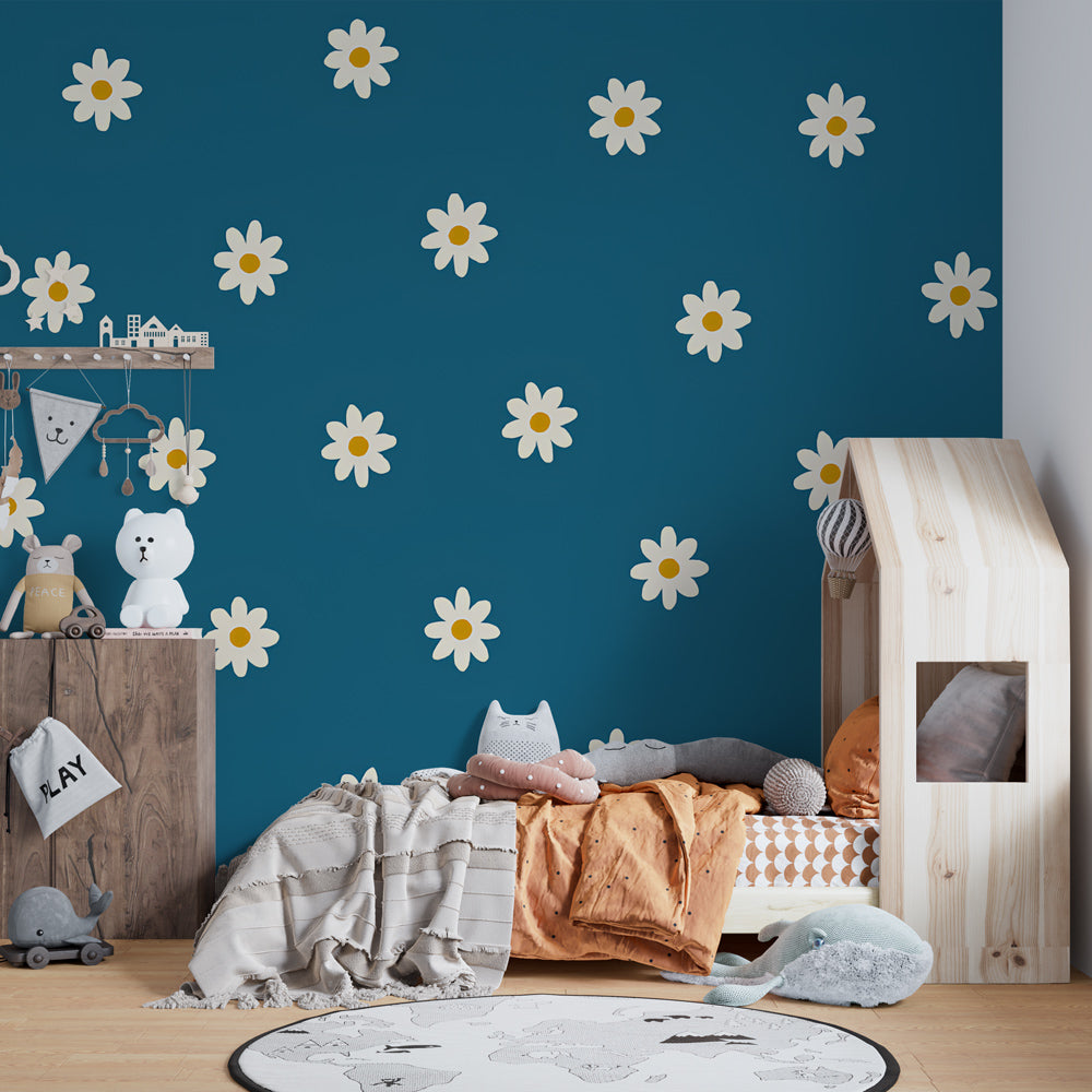 Blue and white floral mural wallpaper creating cheerful atmosphere in children's bedroom