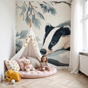 Winter badger mural wallpaper in peaceful nursery setting with natural wood furniture by Kids-Mundo
